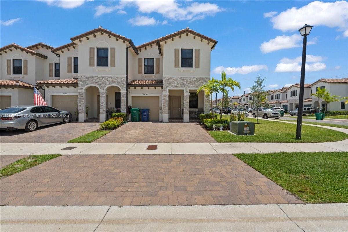 Beautiful 4 bed, 2.5 bath corner unit townhouse in Corsica by Lennar. Built in 2022, it features a bright open layout, modern kitchen with stainless steel appliances, quartz countertops, bar-style counter, and 1-car garage plus 3 driveway spaces. Bedrooms have carpet; stairs and upstairs hallway feature vinyl flooring. The spacious primary suite includes a walk-in closet and double sinks. Owner added a second pantry under the stairs for extra storage. Backyard is fully paved, has a patio awning for shade, a shed, and side access. Includes high-capacity, brand-new washer and dryer. Enjoy pool, gym, and clubhouse.