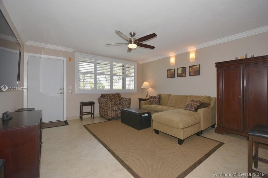 Turn key 1 bedroom and 1 bath condo in sought after waterfront The Woods community. Unit boasts a hip and modern floor plan, open kitchen with maple shaker cabinets, granite and high end stainless appliances. Renovated bath features large shower with frameless glass door. Generous bedroom with ample closet space and sweeping tropical water views. Complex went under a complete renovation, all units feature impact windows and doors. Bring your pets up to 65 lbs total. Pool is just steps away! Just a short walk to Wilton Drive with it's many shops, restaurants and bars.