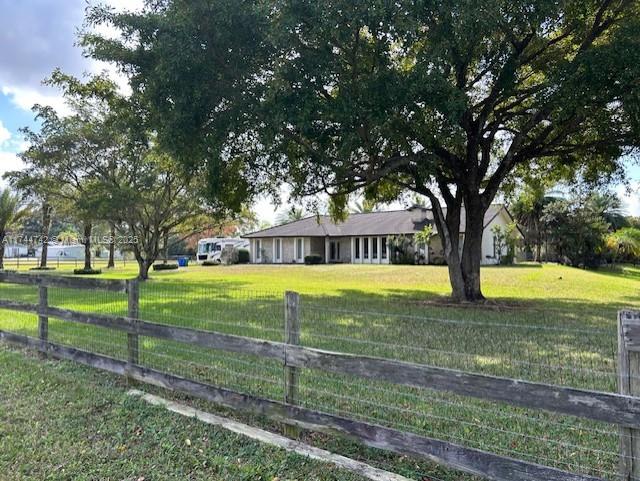 Horse country paradise in Southwest Ranches. Â Totally upgraded 3/2 Ranch style home on 1.9 Acres of land with no HOA obligations. Â Large pool and full basketball court. Â The house has a 5-year-old roof with two new AC units, tankless water heater, impact windows and doors, slate floor in the garage and a fireplace. Tile flooring throughout. SW Ranches is known for its Equestrian atmosphere and with your two horse stalls you can become part of a community that keeps a rural flavor and have all the space you need for your dogs and farm animals. Rolling Oaks, where your future home is located is just minutes from multiple shopping and dining opportunities.