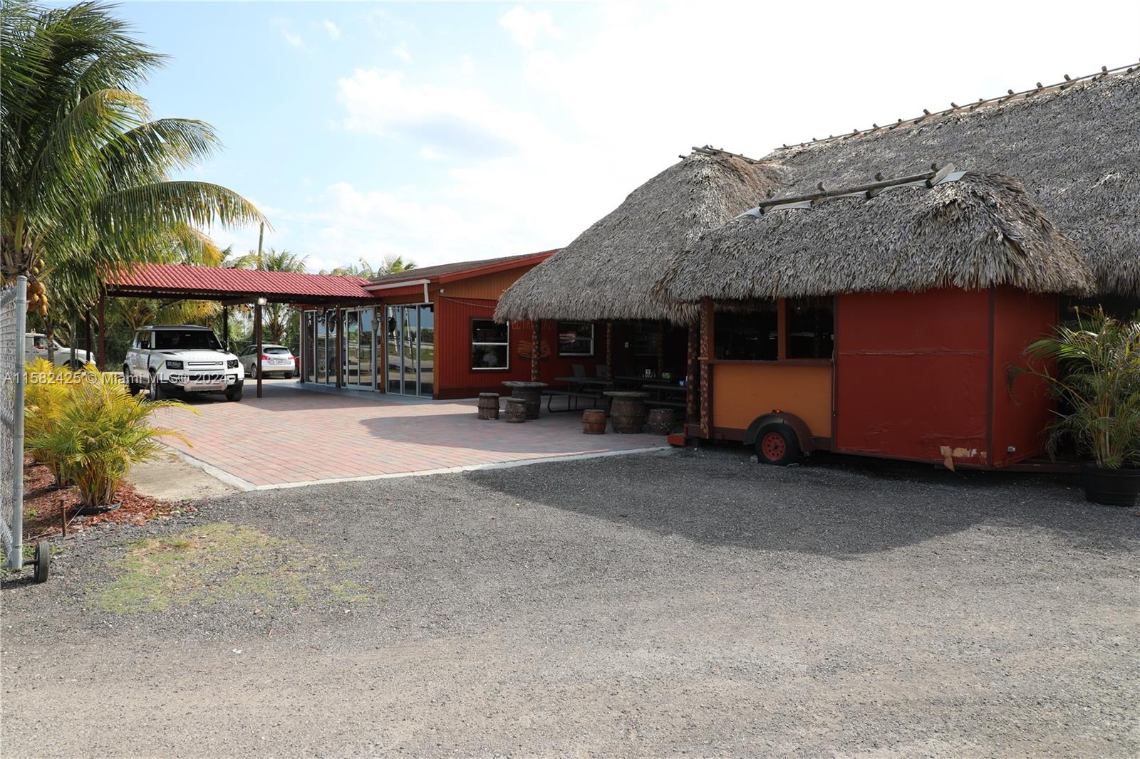 This property sits on 5 acres located in the fertile Redlands of Homestead, FL with an additional two structures in an indoor covered area. This turnkey facility offers the ability to operate as a party venue, shows, and recreational weekend getaways. Inventory will be ready when negotiating which includes all structures, and equipment—very vast parking spaces inside and outside of the establishment. Also, the business has various animals the family can interact with while having a good time. Very profitable and it is the closest entertainment location close to the West Kendall area