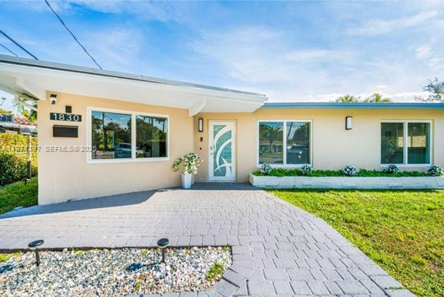 Discover your dream waterfront oasis in this beautifully updated 3-bedroom, 2-bath + den home offering modern living at its finest. Designed for both comfort and style, this move-in ready residence features impact windows and doors throughout, elegant ceramic tile flooring, and a completely new electrical system installed in 2026 for total peace of mind. The contemporary kitchen is a true centerpiece, showcasing sleek stainless steel appliances, modern cabinetry, and a stylish island that overlooks the sparkling pool—perfect for entertaining or everyday living. The open-concept layout is filled with natural light and flows seamlessly into sophisticated living and dining areas. Both bathrooms have been fully remodeled with modern finishes, creating spa-like spaces that elevate daily living. Step outside to your private backyard retreat and enjoy serene water views that provide tranquility and the ultimate Florida lifestyle experience. Whether relaxing poolside, hosting gatherings, or simply enjoying the peaceful waterfront setting, this home offers the perfect blend of design, functionality, and security. A rare opportunity to own a fully updated waterfront property ready to enjoy from day one.