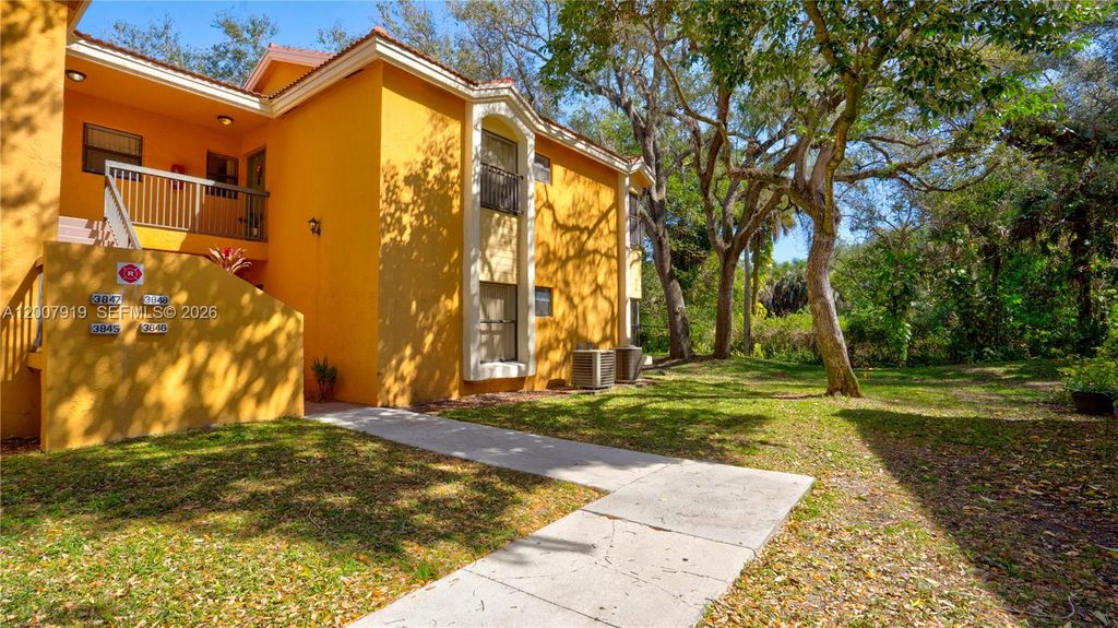 Photo of 3846 Coral Tree Cir #3846, Coconut Creek, FL 33073 (MLS # A12007919)