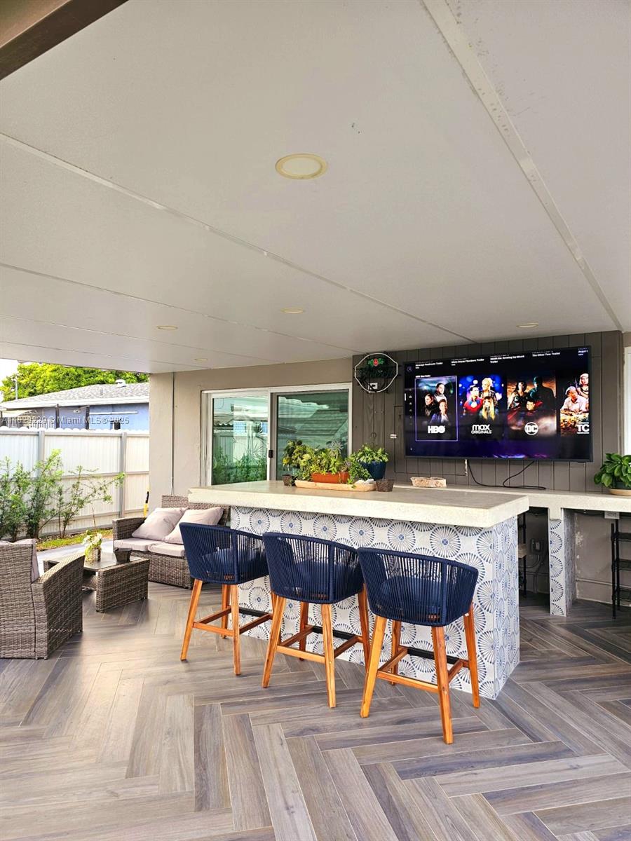 Beautifully renovated home with fresh paint and a new roof. Modern kitchen with stainless steel appliances and ample storage, perfect for entertaining. Enjoy impact windows for safety and energy efficiency, paired with elegant zebra curtains. The backyard features a cozy pergola—ideal for relaxing in Miami’s beautiful weather. For added security, the property has an electric gate ensuring privacy. A perfect blend of style, comfort, and convenience! TOUR VIDEO AVAILABLE