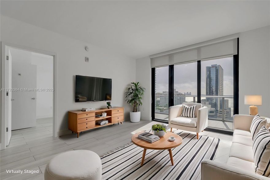 Enjoy the comfort of living in this spacious 2 BR + 3 BA that features: in-unit private elevator, 9-ft high ceilings, & floor-to-ceiling windows. 2 showers + 1 bathtub. In-unit W/D. Enjoy the skyline & partial bay views from the two in-unit balconies. 1 UNASSIGNED parking spot. 1010 BRICKELL is among the most amenitized buildings in Miami: rooftop pool & lounge, indoor poor, outdoor track, fitness center, indoor basketball/racquetball courts, kids playroom, game room, virtual golf, BBQ area, & spa. Located in the heart of Brickell - walking distance to the Metromover (public transportation), restaurant & shops, Brickell City Centre, & Mary Brickell Village. Short drive to Miami Beach, Key Biscayne, Coconut Grove, Downtown Miami, Wynwood/Midtown, & Design District.