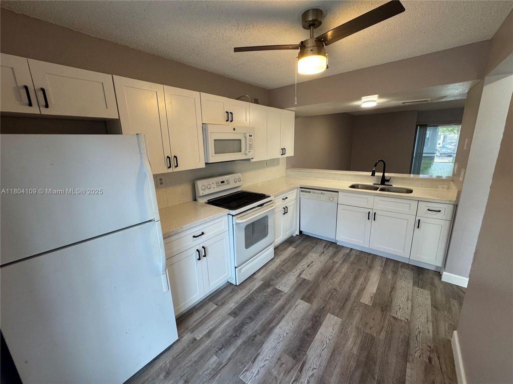 Photo of 843 Crystal Lake Dr, Deerfield Beach, FL 33064 (MLS # A11804109)