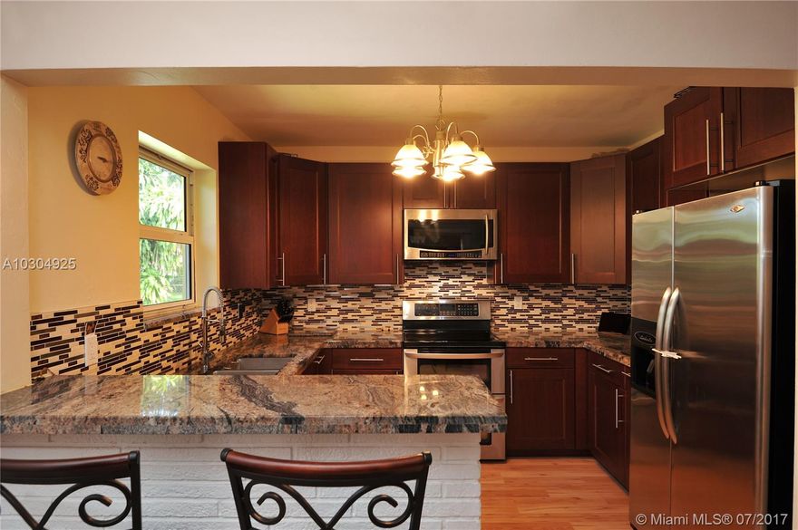 WHERE NEW MEMORIES ARE CREATED... Recently UPDATED home. Tasteful Laminate flooring installed throughout the entire living space, Eat-in Kitchen COMPLETELY RENOVATED in 2012 w/ S.S. Appliances & Granite Countertops, CENTRAL A/C installed in 2012 w/ ALL NEW Duct work. Enjoy ENDLESS hot water w/ the use of a TANKLESS Water Heater in your MODERN Master Bath RENOVATED in 2016. Partial Impact windows w/ Shutters for remaining openings, Roof replaced in 2006. Full service Laundry room w/ storage & sink. Screened in Porch perfect for family entertainment & endless hours of FUN. Open Backyard w/ plenty of room for a pool. ONLY 6 Homes away from neighborhood park & walking distance to Sheridan Plaza for shopping, restaurants, etc...