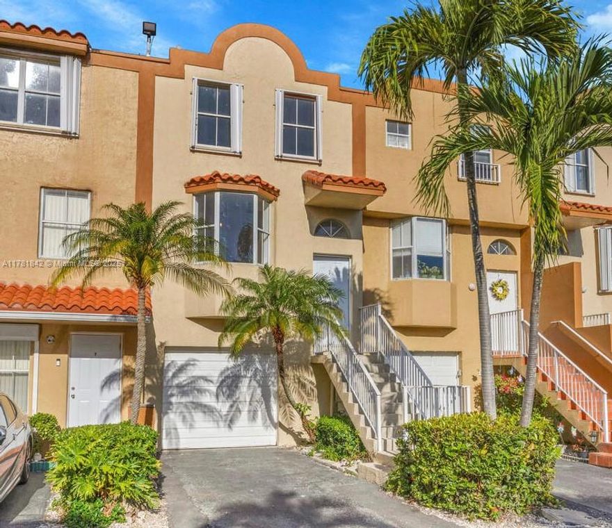 Completely renovated tri-level townhome with oversized yard and 1-car garage in Riviera at Coral Lakes community. Features separate living, dining, and family rooms, a new kitchen with wood cabinets and stainless steel appliances, new laminate wood floors, and updated bathrooms. Accordion shutters throughout. Enjoy community amenities including a pool.