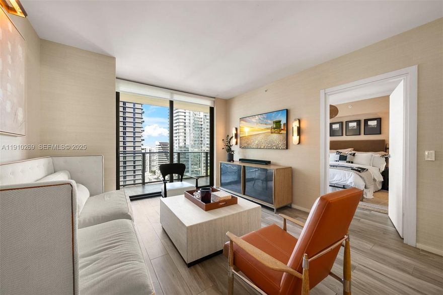 Impeccably designer-redone residence at SLS Lux featuring statement Visual Comfort & Kelly Wearstler lighting throughout and sophisticated Thibaut wallpaper. This versatile split 2-bed, 2-bath plus den showcases custom-built closets in every room, including a chef's dream pantry, in-unit washer/dryer, and private elevator foyer. Breathtaking city views unfold from your oversized balcony in the heart of Brickell, steps to Brickell City Centre and Mary Brickell Village. Resort-style living includes three pools, poolside bar and restaurant service, spa, fitness center, tennis court, and full-service concierge. Building allows 30-day minimum rentals—ideal for flexible living or investment.