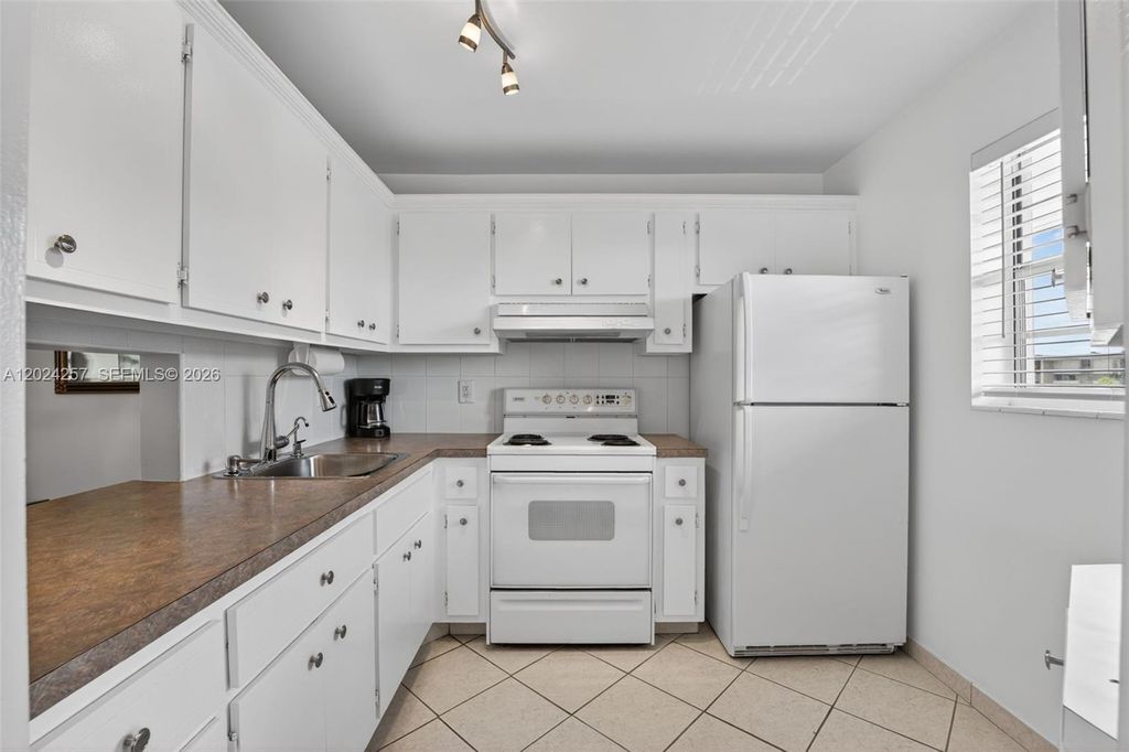 Photo of 2800 NW 47th Ter #303B, Lauderdale Lakes, FL 33313 (MLS # A12024257)