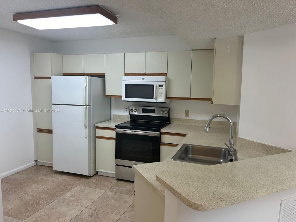 Photo of 8851 Wiles Rd #208, Coral Springs, FL 33067 (MLS # A11621176)