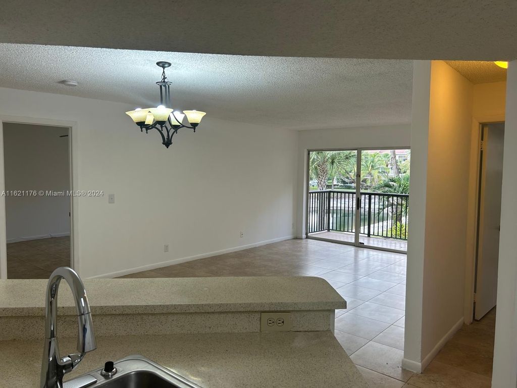 Photo of 8851 Wiles Rd #208, Coral Springs, FL 33067 (MLS # A11621176)