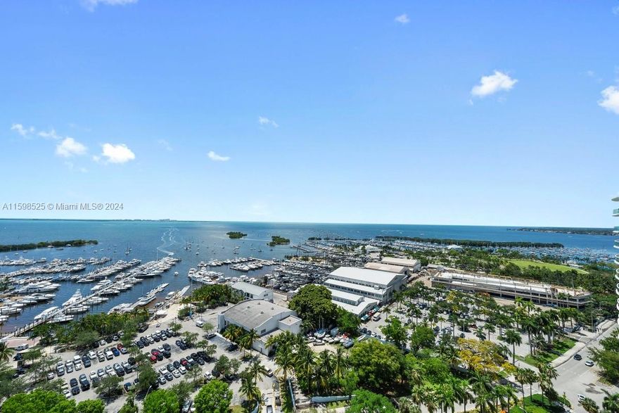 Gorgeous unit w/ direct bay and grove marina views from every room. Private foyer entrance into a 2 Bed/2.5 Bath apartment w/ 10 ft ceilings. Natural light fills every room. Spacious master bedroom offers his & hers walk-in closets with a very large bathroom. This very desirable split-floor plan unit comes with a large open kitchen and a separate laundry room. The renowned Grovenor House is a luxurious building offering incomparable amenities that include: resort style pool w/ cabanas, exercise room, spa w/ steam room & sauna, clubroom, conference room, children's playroom & playground, party room, tennis court, basketball court, 24-hour security, concierge & complimentary valet.