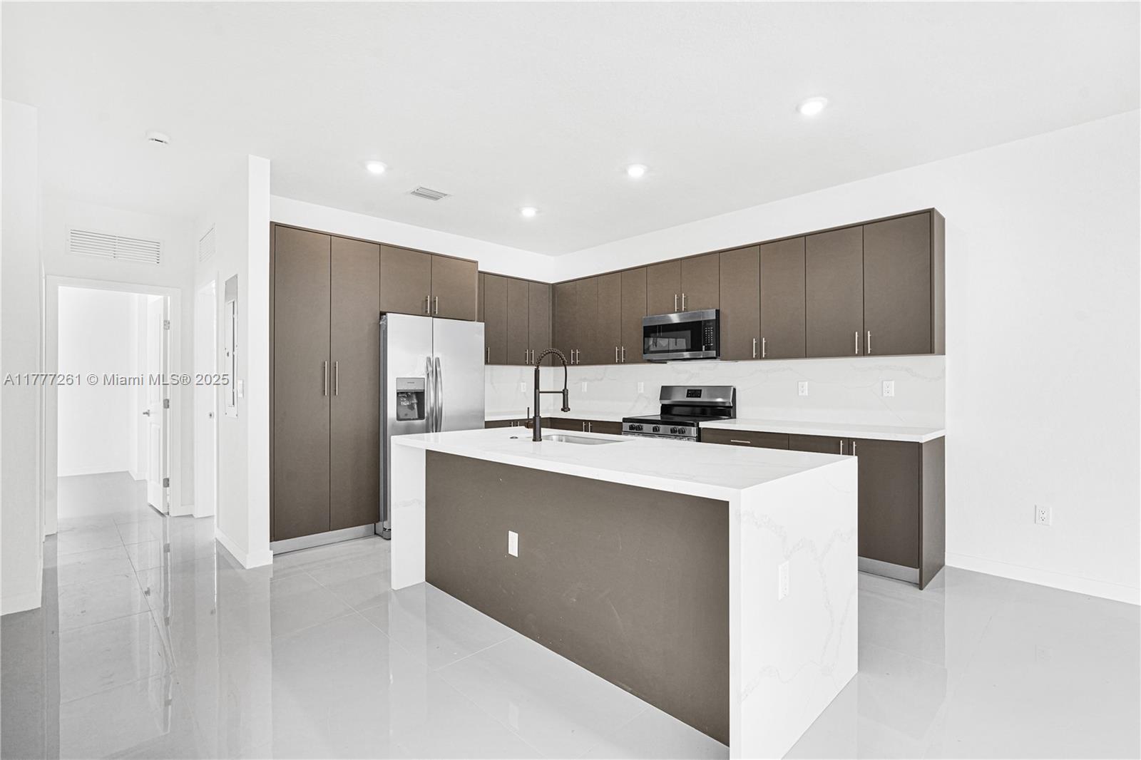 Discover exceptional value with Chloe's Estates, where spacious twin homes offer 2,500 sq. ft. of living space. Choose from two unique models designed for comfort and privacy, featuring high-end finishes like stainless steel appliances, quartz countertops, and 32x32 rectified tiles. Enjoy high ceilings, waterproof vinyl flooring on the second floor, and large backyards big enough for a pool. Conveniently located near shopping, the Florida Turnpike, and US1, these homes provide the perfect blend of space, style, and accessibility—setting a new standard for quality living in South Florida.