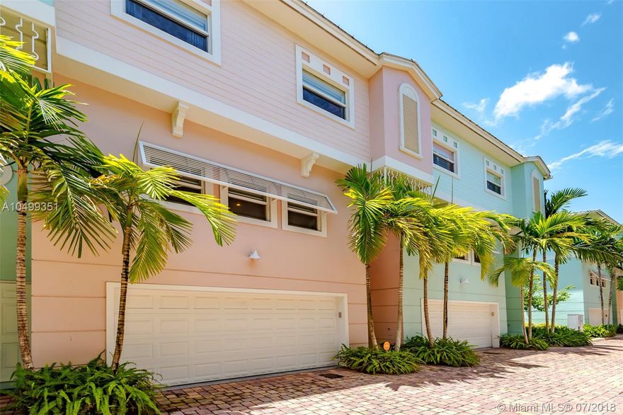 A magnificently stunning Key West style tri-level townhome with 4 Beds, 2.5 Bath & a large 2 car garage.  An oversized first-floor guest room easily functions as a den or office.  Nestled in a quiet, well-manicured and maintained 31-unit complex.  Home includes High Impact Windows, an Open Floor Plan Kitchen, Breakfast Bar, SS appliances with a topnotch 2018 Refrigerator and lots of storage space. Relax in a large master suite w/ a walk-in closet.  Ceramic tile and upgraded laminate flooring premium window treatments.  Homeowner spared no expenses with a powered patio awning, motorized terrace sunscreen, stylish ceiling fans, crown molding in the great room & full size stacked W/D.  Stone pavers in backyard make entertaining fun.  This immaculately kept turnkey home is a MUST SEE!!!!!