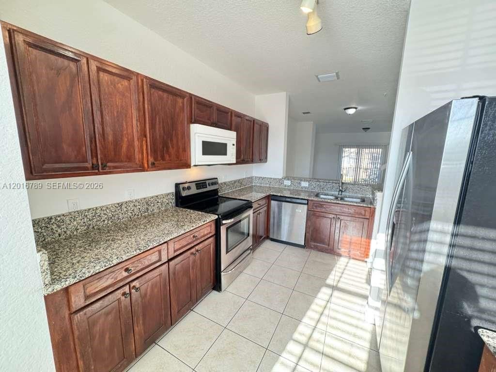 Photo of 1984 NE 5th St #203, Boynton Beach, FL 33435 (MLS # A12016789)