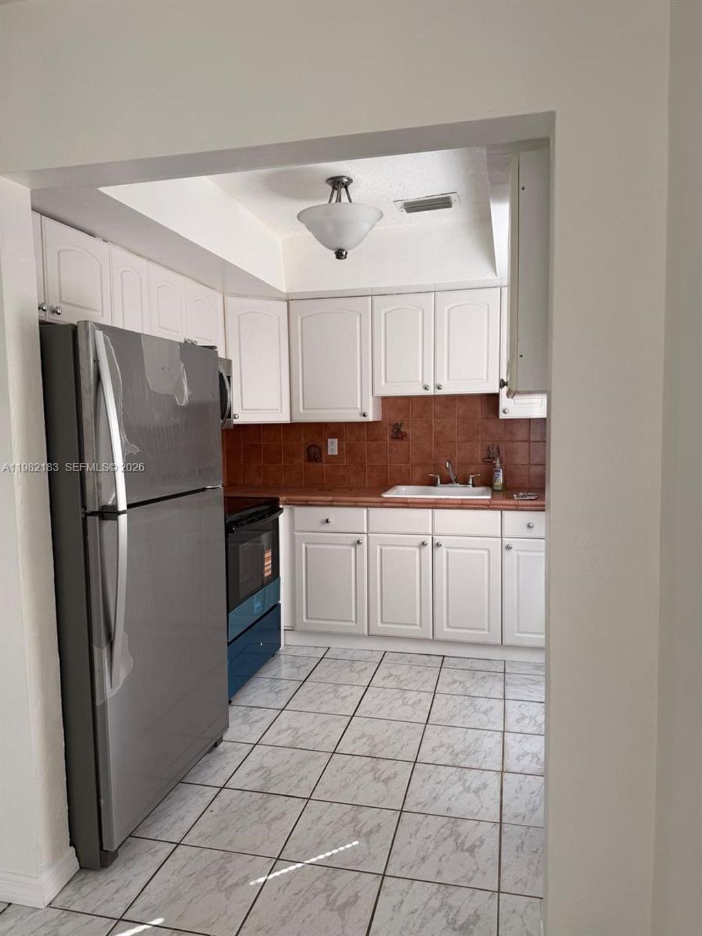 Photo of 310 NE 58th St #B, Oakland Park, FL 33334 (MLS # A11982183)