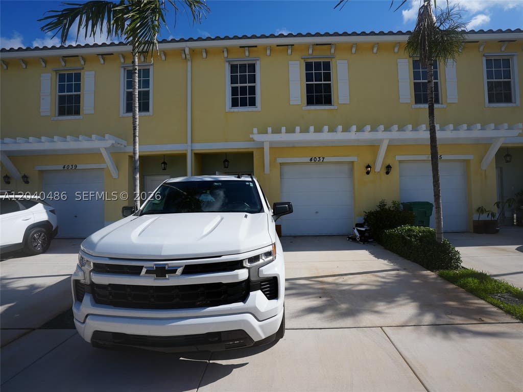 Photo of 4037 NW 10th Pl, Lauderhill, FL 33313 (MLS # A12040486)