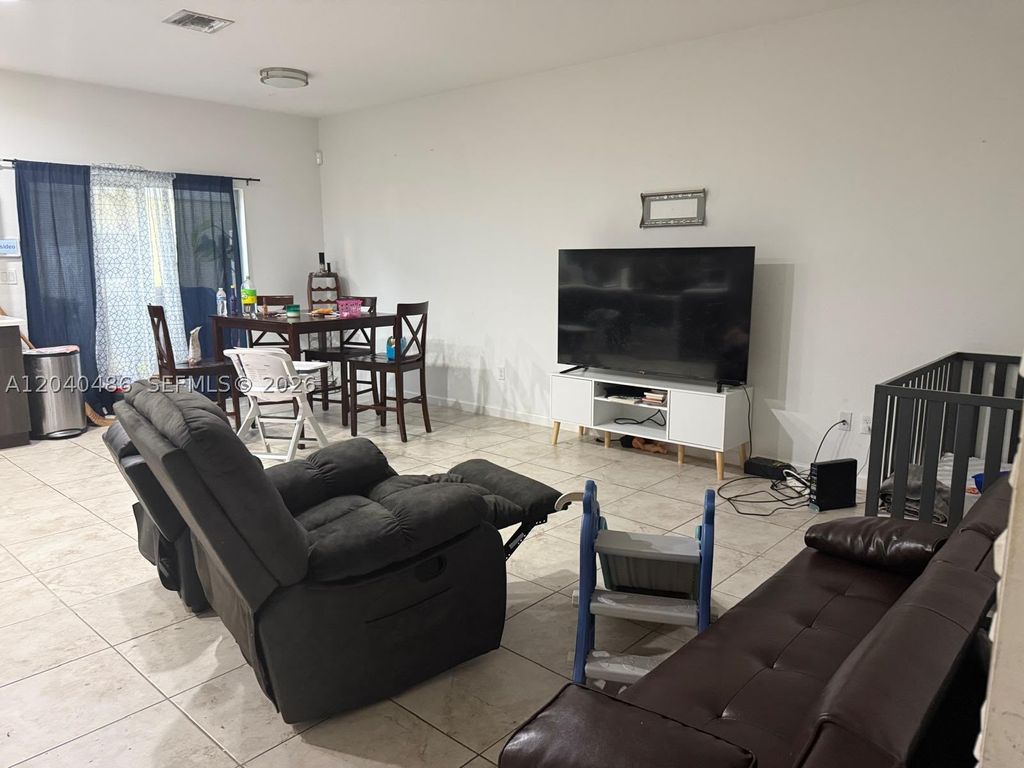 Photo of 4037 NW 10th Pl, Lauderhill, FL 33313 (MLS # A12040486)