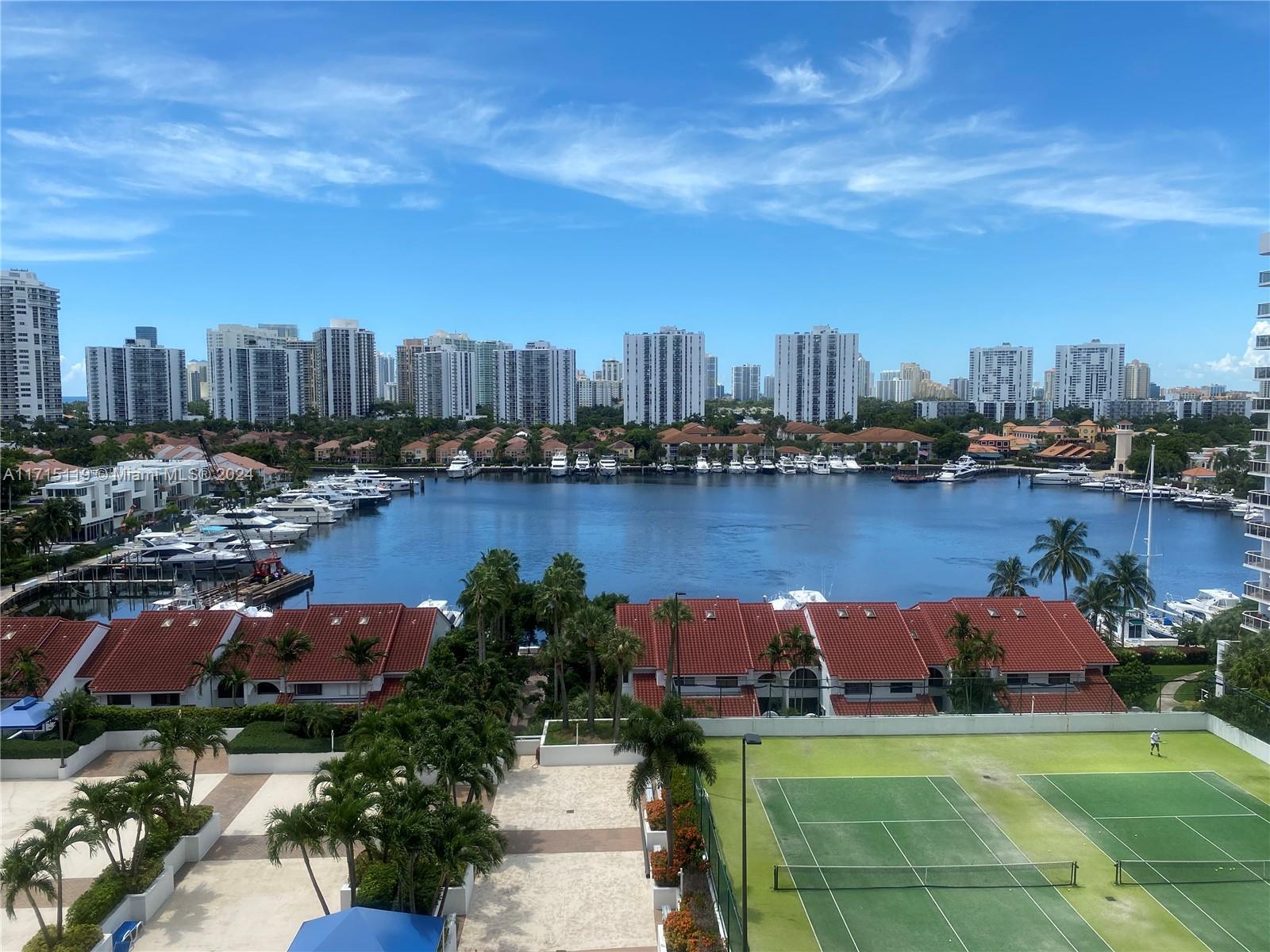 STUNNING & GORGEOUS panoramic view of the beautiful Waterways Marina and beyond from every room in this large and bright 2 bedroom 2 bath unit with very spacious 1,430 square feet (largest 2/2 in Harborside). Split floor plan with floor-to-ceiling windows, oversized balcony and hurricane shutters. Full size washer/dryer inside unit. 2 assigned/covered parking spaces. This beautiful, elegant and newly renovated building features 2 pools, 2 hot tubs, sauna, 2 tennis courts, gym, multi-purpose room, ample free guest parking and more. Large air-conditioned storage unit. 24-hour lobby concierge and security. Pet friendly building. Walk to marina, intracoastal, restaurants, market, post office, high school, Whole Foods, Gulfstream Park, etc. AFFORDABLE LUXURY AT ITS FINEST! See Broker remarks.