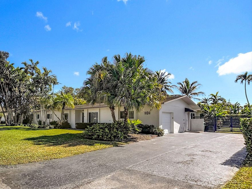 Incredible opportunity to purchase a 5-bedroom home in this neighborhood! This split-plan home is well laid out with three bedrooms on one side and two on the other. Large spaces for entertaining that open out to the sparkling, tropical pool and patio. Updated flooring through te whole house. Impact windows and doors throughout provide the hurricane protection you want. This home sits close to great shopping and dining, as well as quick access to highways.