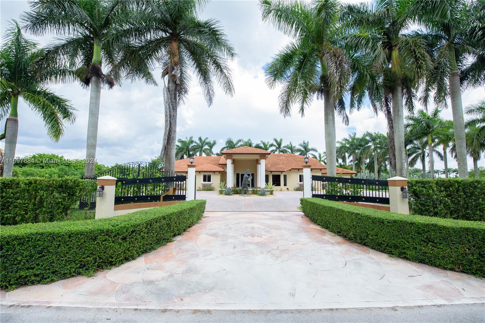 4.29 Acre custom Gated Home. Perfect Home for your big family!! Main house built (1995) 4 Bedroom 3 Bath with over 4000 sq ft. The kitchen features an island with a cooktop, granite countertops, wood cabinets, a wine cooler, and stainless steel appliances with views of the backyard and pool. The outside features a Huge covered patio perfect for entertaining! Pool w/ Fountains, keystone deck (45x55) & Tiki Hut w/electricity. The garage is 1,600 sq ft. and can hold up to 8 cars. Guest house built (1990) 1600 sq ft. 3 Bedrooms 2 Bathrooms, kitchen dining room, living room, and its own washer/dryer hook up. Separate unit- 100 sq ft. Office/Studio. Fenced 4-dog kennel. Plenty of room for horses and other animals. 30 minutes the Florida Keys. 2# Folio#30-6802-000-1660.