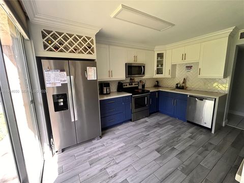 Photo of 7532 NW 86th Ter #104, Tamarac, FL 33321 (MLS # A11984650)