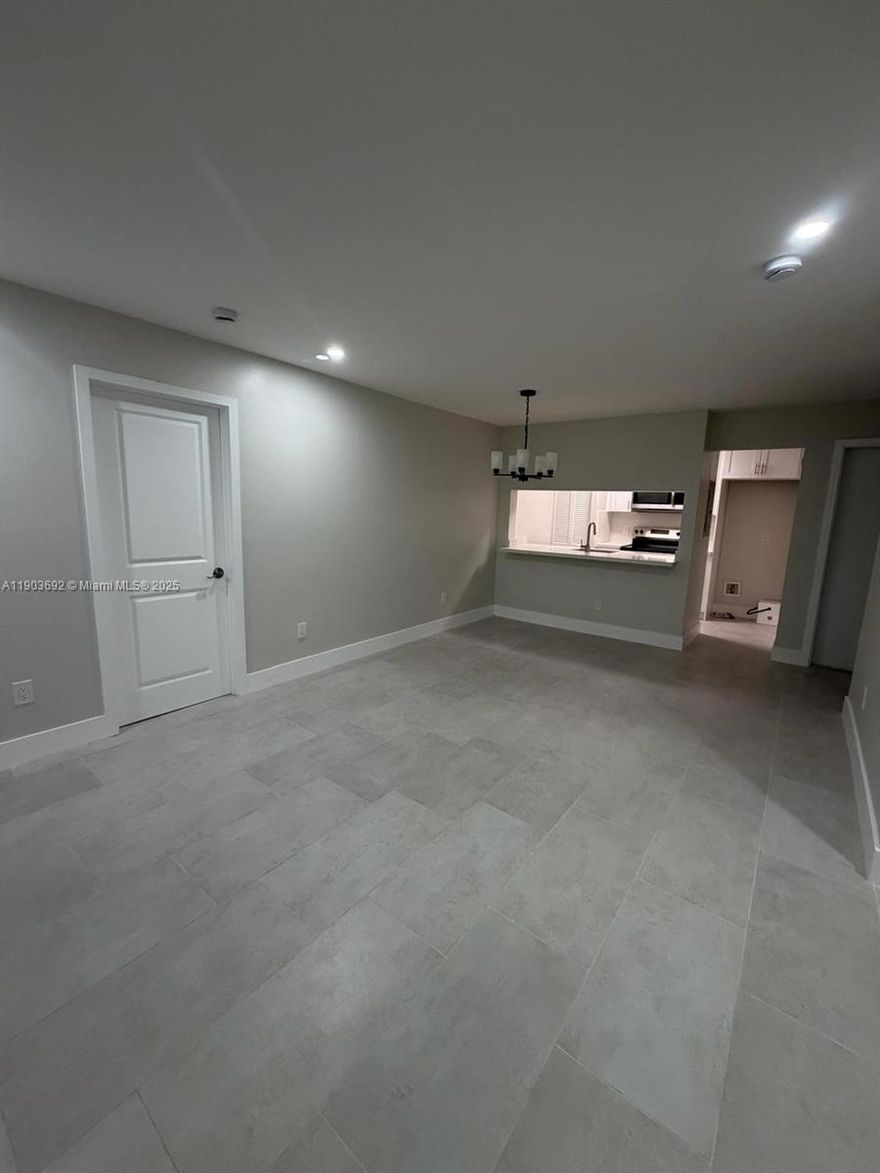 Discover comfort in this beautiful, fully remodeled second-floor condominium! With an open-concept design, this stunning home features an elegant kitchen with quartz countertops, stainless steel appliances, and custom cabinetry. The spacious living room is filled with natural light and connects with the elegant dining room and balcony. The primary suite offers a walk-in closet and a renovated en-suite bathroom. The second bedroom also features a walk-in closet. The third bedroom is perfect for a home-office.  The second bathroom also beautifully updated. Enjoy excellent amenities, including, pool, gym, clubhouse, & tennis courts. Located close to shops, restaurants, and entertainment. Move-in ready and offering the perfect combination of luxury and convenience. Don’t miss this opportunity!