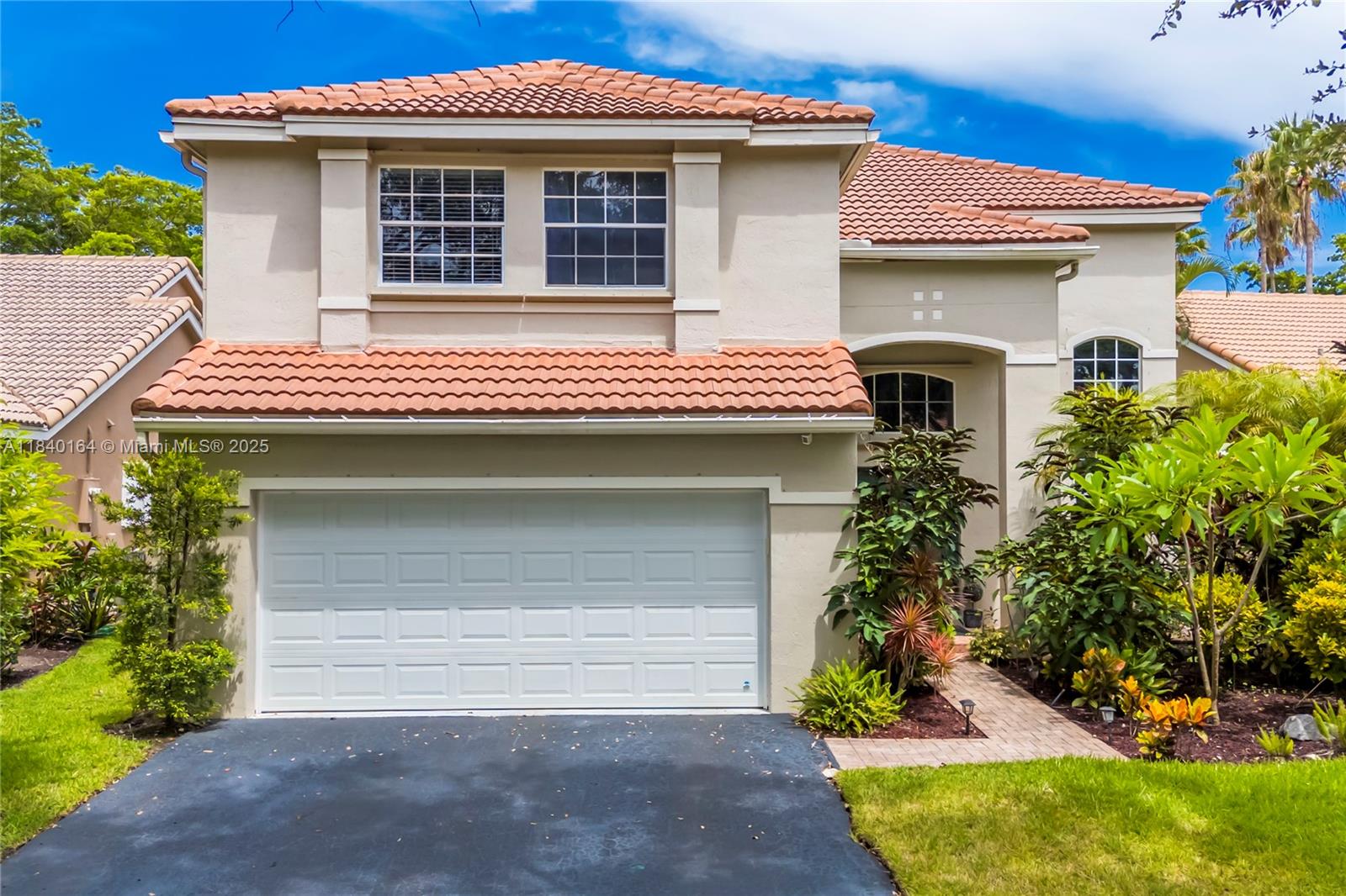 Welcome to this beautiful 4BR/2.5BA home in the sought-after Hibiscus Island community in Weston! Enjoy serene lake views from the screened-in lanai, primary suite, and guest bedroom. The spacious primary suite features charming farmhouse doors leading to the updated primary suite featuring dual sinks, a soaking tub, shower and two closets. All bedrooms are upstairs, along with two full baths; a half bath is conveniently located downstairs. Home features all-new light fixtures throughout all-new SS appliances, and a brand-new AC. Garage includes an EV charge outlet & a new impact garage door. All "A" rated schools. Peaceful, picturesque living in a prime location!