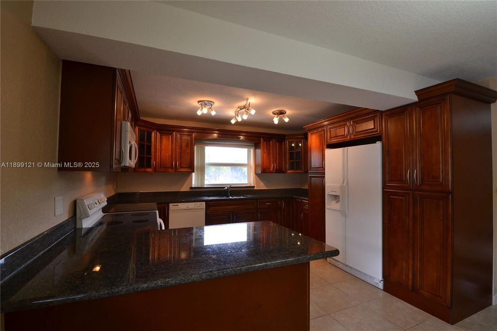 Photo of 10241 NW 35th St #4, Coral Springs, FL 33065 (MLS # A11899121)