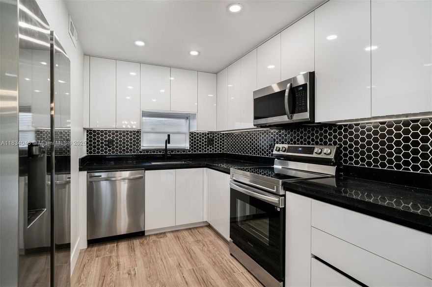 The epitome of 55+ Florida living! 1,170 SF 2-bed/2-bath, a first-floor corner unit thoughtfully remodeled with a modern flair, offering an open-concept layout with views of the adjacent golf course. Featuring spacious, sunlit bedrooms, a sleek kitchen, and updated bathrooms, this home offers both comfort and style. Enjoy your private direct exit to golf course views while taking advantage of the community’s resort-style amenities, including but not limited to; a heated pool, fitness center, tennis and pickleball courts, art classes, and onsite shows. Convenient guest parking. Near premier shopping, dining, and nightlife (Hard Rock Casino).