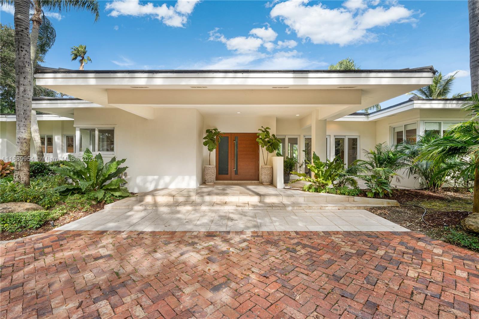 Welcome to Paradise in Pinecrest!Experience the best of South Florida living within this lush, tropical,gated-acre estate.This beautifully designed 4 BD/4BA home oozes positive vibes & offers an open,updated floor plan w/new flooring & modern kitchen seamlessly flowing into a spacious family room & oversized living/dining area.A separate office,gym,& versatile study/den, provides plenty of space for work/relaxation.Updated bathrooms,solar system,& impact windows/doors ensure safety & tranquility while the expansive patio/resort-style pool create a perfect setting for gatherings/entertaining.Located sidewalks away from Pinecrest Gardens,a vibrant farmers market, & soccer fields, this home is ideally situated for convenience & lifestyle.Who is ready to call this paradise in Pinecrest, home?