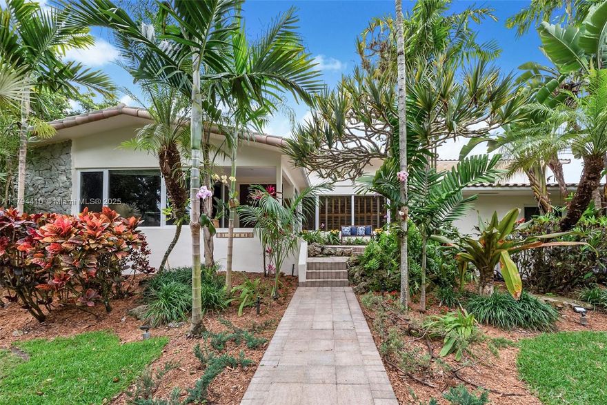 Exceptional value—now offered for under $600/sf in a premier Pinecrest neighborhood where prices exceed $800/sf. This enchanting 2-story residence exudes timeless charm & curb appeal. Majestic royal palms & lush gardens welcome guests onto a scenic veranda. Inside, beyond the grand foyer, discover a large home theater & office with sweeping views of your tropical oasis. The spacious kitchen features granite countertops, custom cabinetry & extra storage. Relax in the sunlit Florida living room with panoramic views of your backyard estate. The oversized primary suite is move-in ready or customize to taste. A warm, welcoming home—ideal for a growing family in a prime Pinecrest location.