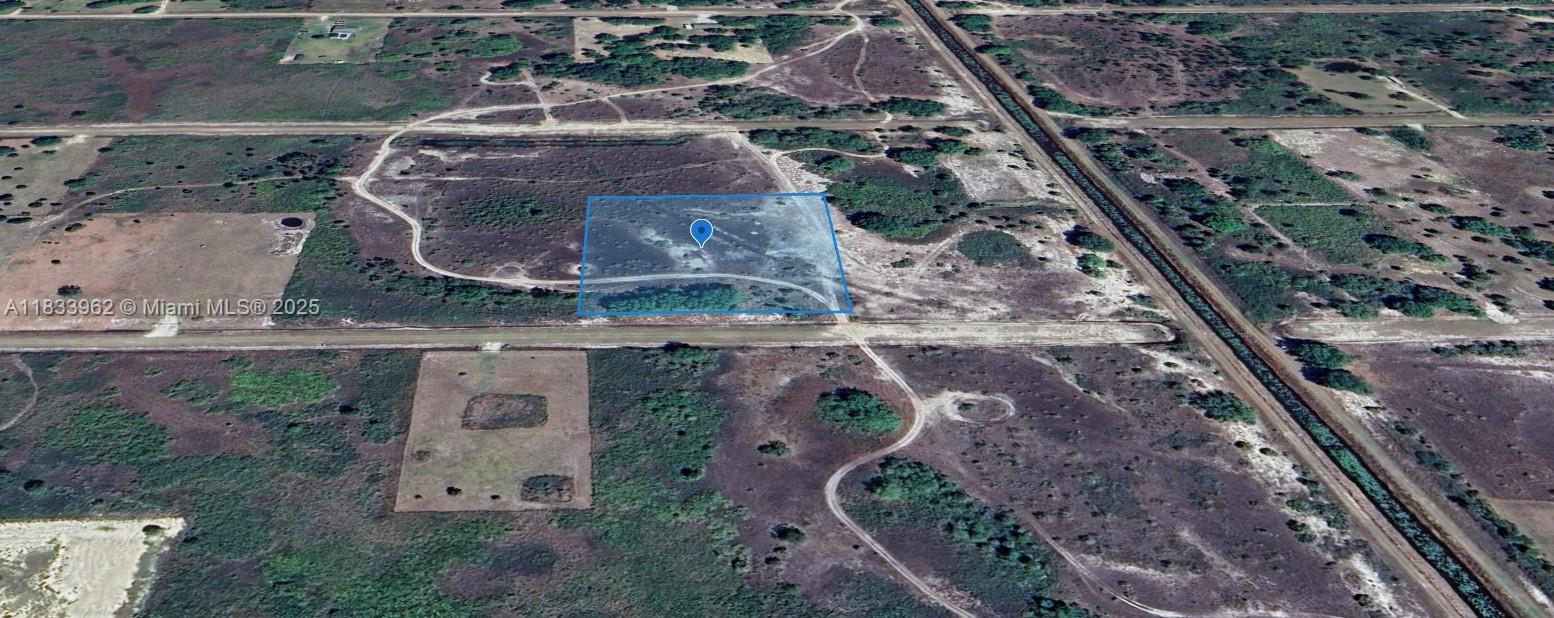 OWNER WILL FINANCE!!! 2.5 ACRES OF HUNTER'S PARADISE!!! This unique property offers endless opportunities for outdoor enthusiasts. While currently not buildable, the lot is perfect for those seeking a peaceful escape for hunting, camping, ATV adventures, or stargazing under the clear night skies. This area is is known for rural properties, secluded and located just one lot away from Kissimmee Prairie State Preserve. The Kissimmee river flows into Lake Okeechobee which is well known for some of the best fishing in the world. You can access the property through wide dirt road. You will need an ATV!!! OWNER WILL FINANCE!!! $5K DOWN, MONTHLY PAYMENTS OF $394.04 FOR 60 MONTHS @ 7% INTEREST RATE.