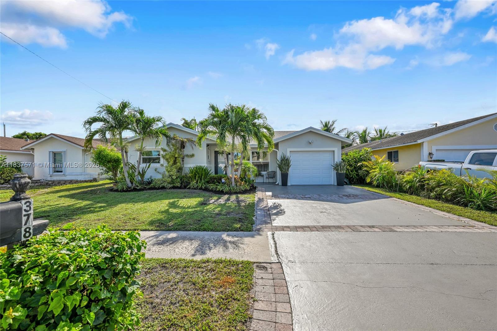 Beautifully updated 3-bedroom, 2-bath home in Deerfield Beach with no HOA! This move-in-ready property features a newer roof , hurricane-impact windows , and new garage door. Enjoy Florida living with a saltwater pool, travertine patio in a private fully fenced backyard—perfect for entertaining. The interior boasts an open layout with vinyl flooring throughout, a spacious kitchen with granite countertops, and stainless steel appliances. Split floor plan offers privacy for the primary suite. Located close to major highways, shopping, dining, and just minutes from the beach. A must-see property with modern upgrades and no community restrictions!
