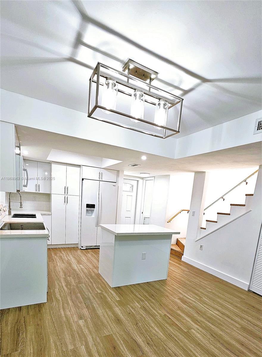 Top-floor two-story condo. Great location! This delightful 2-bedroom, 2.5-bathroom condo is within the Patios West One community in the Fontainebleau area. The home is just a short drive from Dolphin Mall, International Mall, Florida International University, and major highways. On-site features include a pool and tennis court. Cross the threshold into a warm welcome with an open layout, natural lighting, neutral decor, high-impact windows & doors, ceramic tile, luxury vinyl plank flooring, and new AC. The kitchen is gorgeous, with fresh updates, countertops, and cabinets. The serene main bedroom includes an updated bathroom, a walk-in shower, and a private balcony. The other bedroom is quiet, with ample wardrobe storage. Assigned parking. Pet-friendly. Association approval is required.