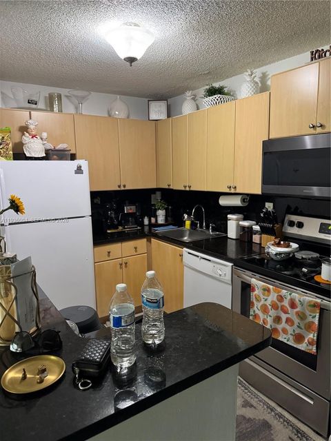 Photo of 7155 NW 179th St #112, Hialeah, FL 33015 (MLS # A11936004)