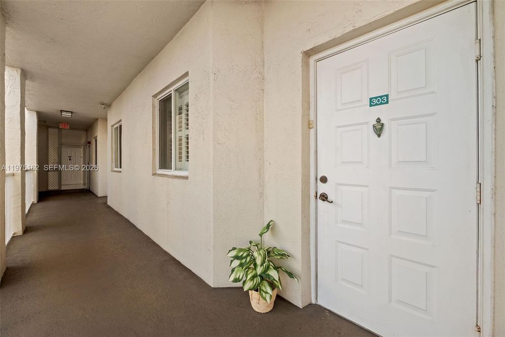 Photo of 7727 Southampton Ter #303, Tamarac, FL 33321 (MLS # A11975162)