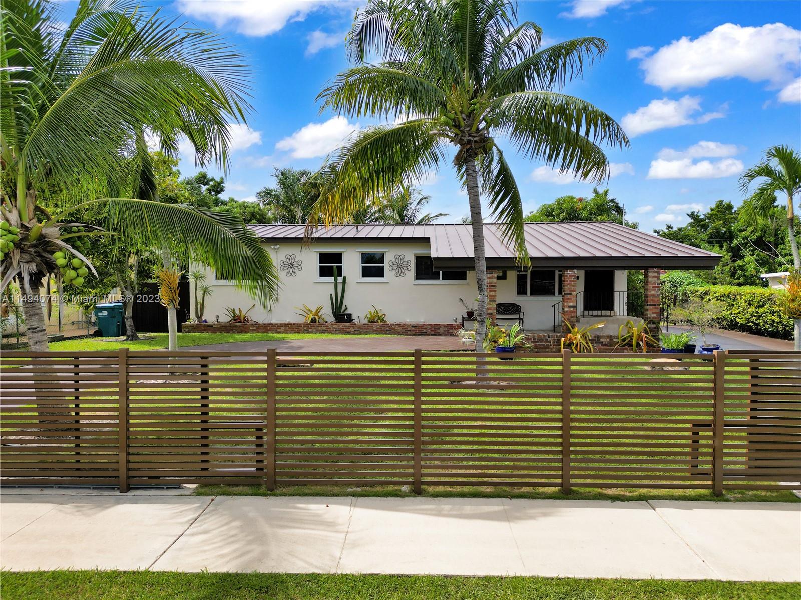 Discover the epitome of South Florida living in this beautiful 3-bedroom, 2-bathroom home with an additional two rooms currently used as a den and a Florida room. Nestled in the sought-after Westchester area this residence features a large 10,650 sq ft patio with a pool, coconut and fruit trees, a shed, travertine-floored outdoor spaces, a circular driveway with space for 10+ cars, original wood floors and front door, hurricane shutters, and a Ring alarm system with sensors. Recent upgrades include the recently renovated kitchen and laundry room, new metal roof, new water heater, and a new galvanized steel gate for added convenience and security. Don't miss the chance to own a piece of South Florida paradise in a prime location. Please do not disturb residents.