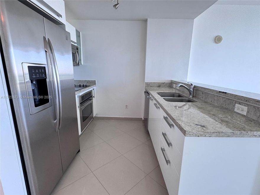 Cozy and gorgeous unfurnished 1 Bedroom and 1.5 bathrooms at prestigious Blue Condo in Miami with Beautiful Views, floor to ceiling windows, granite countertop, stainless steel appliances, washer/dryer in unit. Rent includes 1 assigned space. Resort Style, 1 East Bayfront infinity heated pool & hot tub, West Pool, Hot Tub, movie theater, GYM, Sauna, Steam room, Kids Playroom, game room, business center, bbq area, 24hr doorman, convenience store, community social activities. Semi-private elevator foyer. Few minutes to Design District, Wynwood and Shops at Midtown. 5 Miles to Miami Beach, 8 Miles to MIA airport, 4 miles to Brickell.