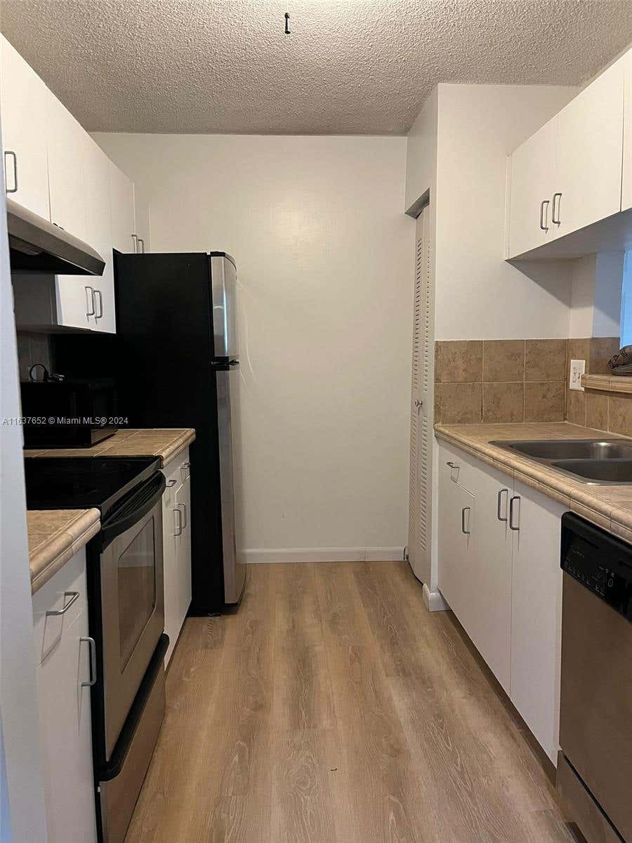 Photo of 1715 Village Blvd #203, West Palm Beach, FL 33409 (MLS # A11637652)