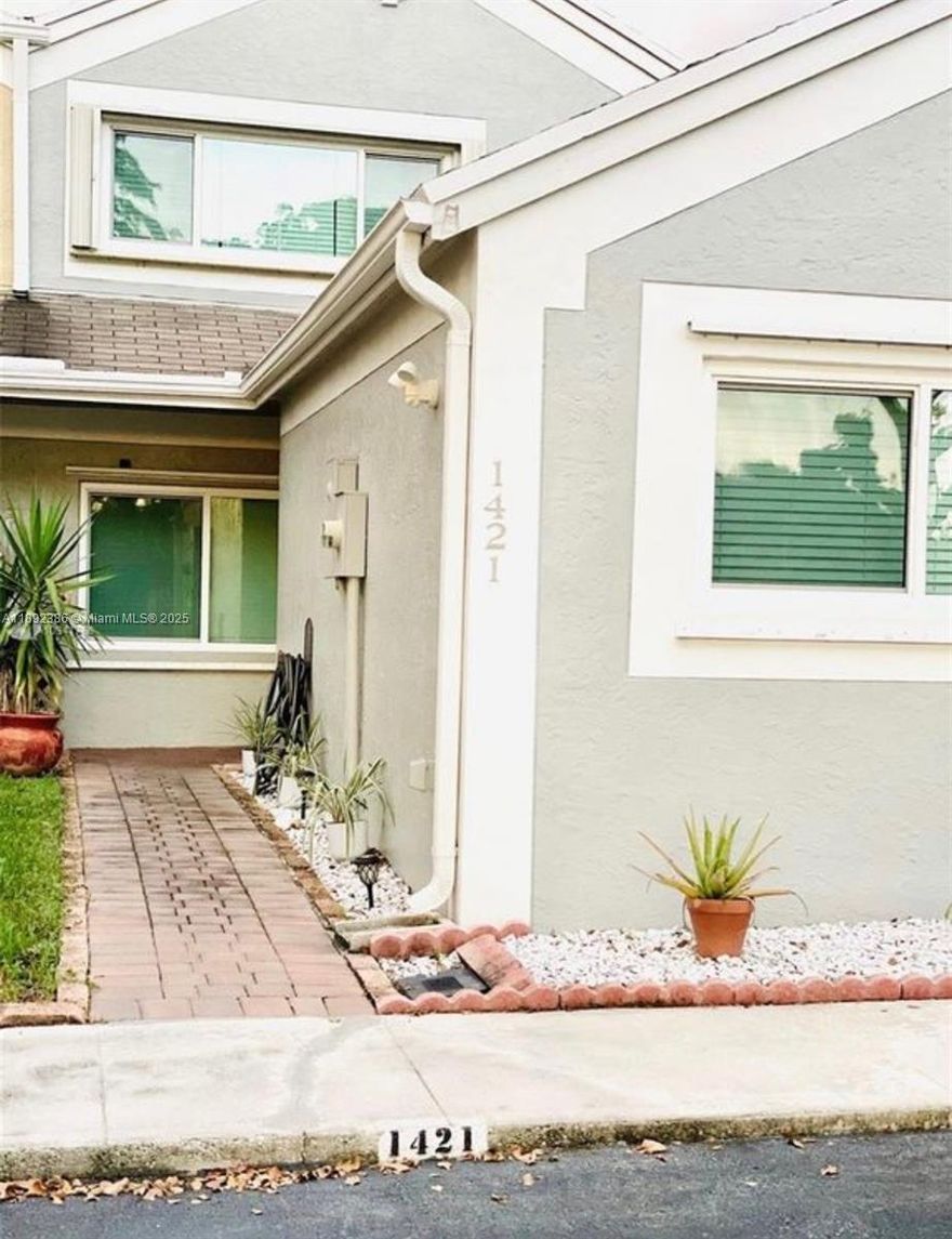 You've found the one! This stunning lakefront 3 bed, 3 bath two-story townhome features a modern upgraded kitchen, large tile floors, new appliances, updated bathrooms, and plenty of storage. Enjoy peaceful sunrises from your back patio overlooking the lake. Includes 2 parking spots plus guest parking right out front. This community of Flamingo Villas boasts 24hr security, 2 pools, Tennis Courts and a Gym w/Sauna Room. Conveniently located within walking distance to Memorial Hospital West, CB Smith Park, and Pembroke Lakes Mall. Welcome home!