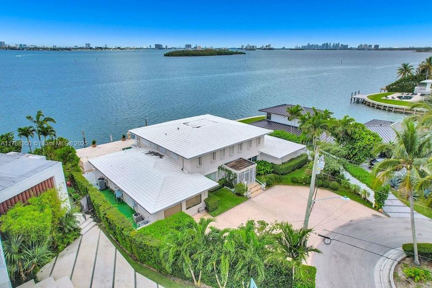 A Bayfront Opportunity Like No Other. Perched on a 12,170 SF point lot with sweeping, unobstructed bay views, this rare waterfront property offers incredible potential in one of Miami’s most desirable locations. Whether you envision enhancing the current home or building a custom estate from the ground up, the expansive frontage and dramatic views create the perfect backdrop. With over 100 feet on the open bay, this is a one-of-a-kind opportunity to craft a legacy property in a truly exceptional setting.