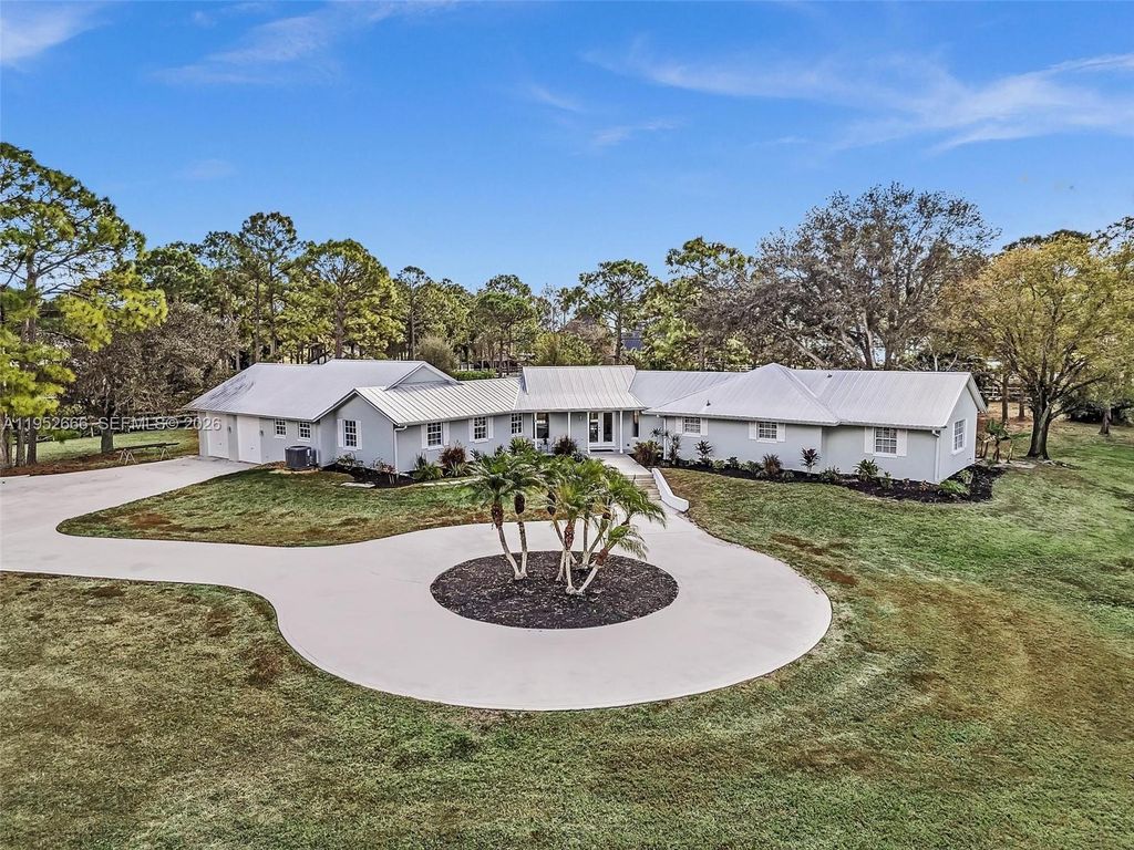 Photo of 10006 SW Tyler Ter, Palm City, FL 34990 (MLS # A11952666)