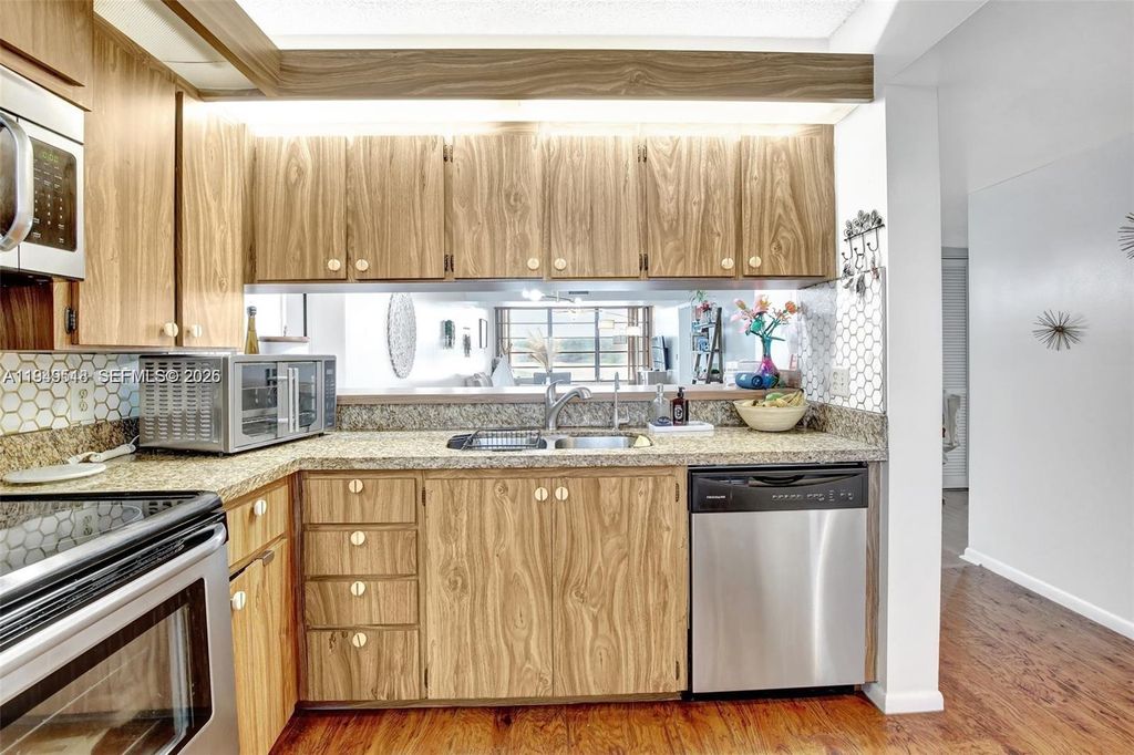 Photo of 1532 Whitehall Dr #202, Davie, FL 33324 (MLS # A11949518)