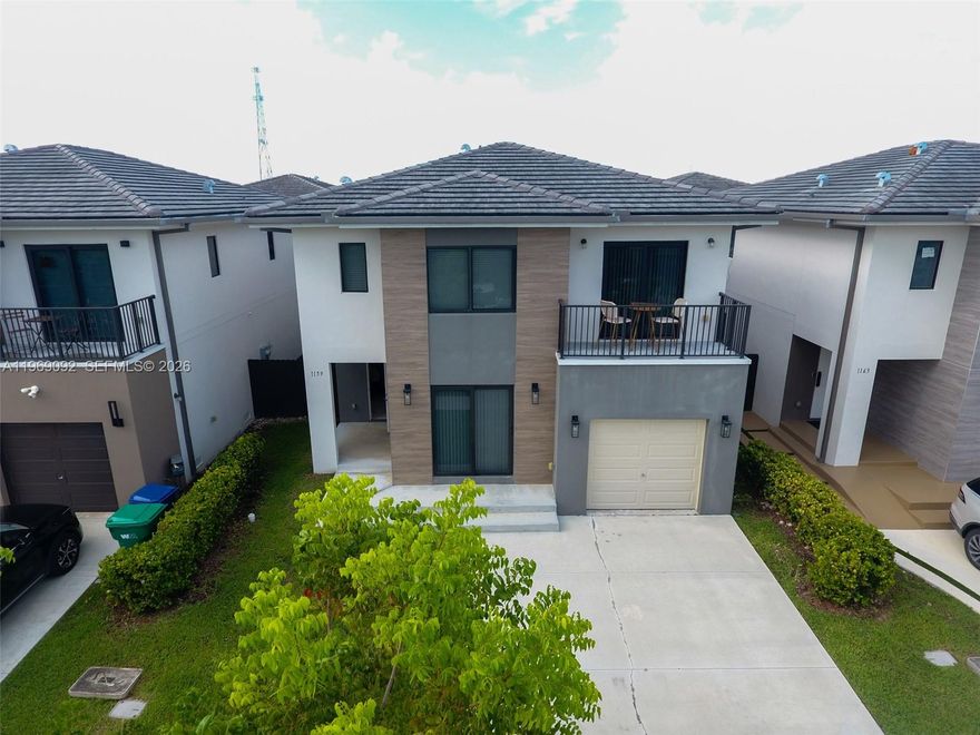 Modern 5-Bed / 4.5-Bath – Florida City Built in 2023, this stylish 2-story concrete home offers 5 spacious bedrooms and 4.5 baths, including a 1ST-floor guest suite with private entrance—ideal for family, visitors, Open kitchen with stainless steel appliances & stone countertops Porcelain tile floors, impact windows & doors Large primary suite with balcony, walk-in closet & double vanity bath Full-size washer/dryer Garage + driveway for up to 4 cars. Fenced backyard Located in a welcoming community, this home blends comfort, function, and opportunity. All information deemed reliable but not guaranteed