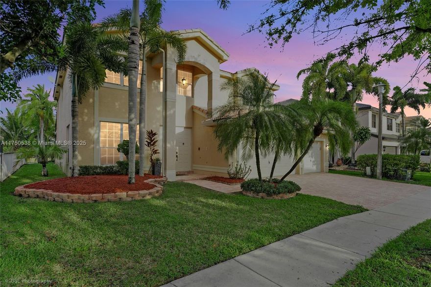 Spectacular lakefront/pool home with gorgeous interior. Welcome to luxury this beautiful abode offers wood and ceramic tile throughout the living areas. The spacious kitchen is a chef's dream! It features custom cabinets, granite countertops, SS appliances, and a built-in wall oven. Primary suite includes sitting area, his/hers walk-in closet, two sinks, separate tub & private balcony overlooking the pool. This oasis features a salt-water pool, and an outdoor kitchen w/ build in grill for entertaining. Located in a prestigious gated community of Silver Lakes. Prestigious neighborhood with A-Rated schools. Conveniently near parks and recreation. HOA includes internet, cable, a community club house, tennis courts and  playgrounds.