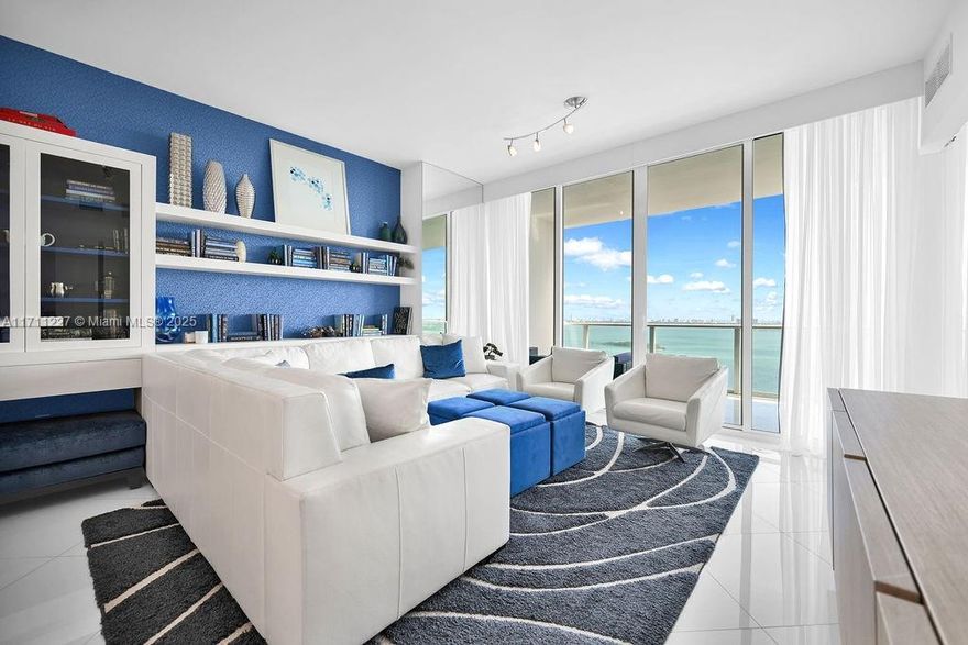 This exceptional, fully furnished unit, expertly designed and decorated by Steven G, offers luxurious living with no detail overlooked. Spanning approximately 1,200 square feet, this one-of-a-kind home features a private elevator that opens to a private foyer, two bedrooms, and two full bathrooms. Enjoy breathtaking views of the bay and city from nearly every room. Paramount Bay provides resort-style amenities, including two pools, a fitness center, a private residents' club room, 24-hour security, and front desk assistance.