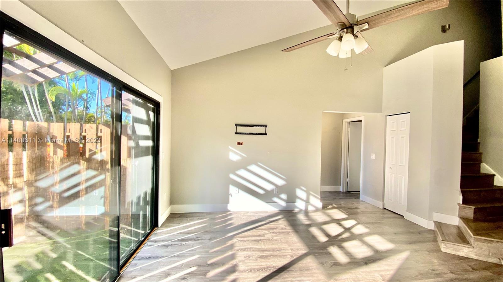 Beautifully updated 2/2 townhome with an open concept features volume ceilings, huge second floor master with a beautifully updated master bath and spacious walk-in closet. Kitchen has been tastefully updated with white shaker cabinets, quartz counters, & new stainless steel appliances. Neutral gray tones throughout the home including brand new planked vinyl flooring. Entry-level boasts open living and dining area, large bedroom, fully remodeled full bath, & Laundry/Utility room featuring new full-size washer and dryer. New A/C, new hot water heater. Accordion storm shutters. Enjoy large back yard park featuring basketball, volleyball, covered playground, and covered pavilions.