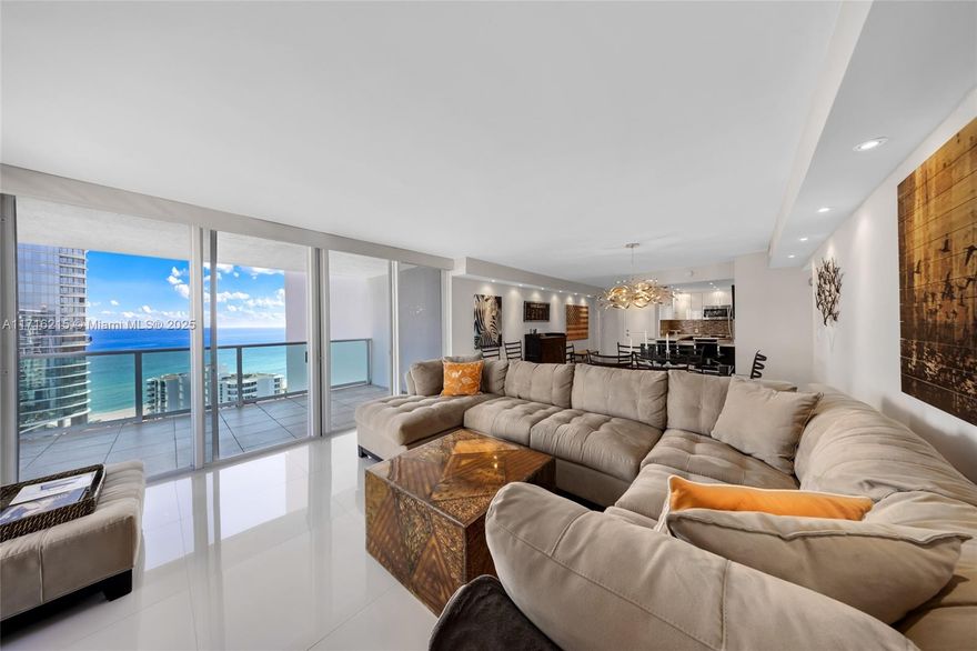 This turn-key furnished 2 bed, 2 bath condo, a spectacular corner unit, offers breathtaking sunrise-ocean views and picturesque sunset-Intracoastal vistas.  Enjoy a large wrap-around balcony off the great room, along with a private balcony off the primary suite. Renovated, the open concept floor plan showcases porcelain tile throughout, creating a seamless flow for entertaining or relaxing.  Split Bedroom plan offers privacy for you and your guests.  The building boasts a newly renovated lobby and resort-style amenities including a heated pool, gym, tennis courts, and worship room, along with a vibrant party room for gatherings. Just footsteps away from the beach and Haulover Park, this condo is a true paradise. Minutes to Bal Harbour Shops and restaurants. Sunny Isles living at its best!