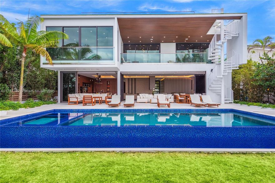 MODERN WATERFRONT VILLA with amazing open bay views featuring around 6,000 sf of living area including 6 beds, 6/1 baths. Magnificent Italian finishes throughout, large master bathroom and closet, gourmet kitchen, with chefs' kitchen, high end appliances. Open living area, Elevator to rooftop with spectacular views. Custom Italian furniture is included. Swimming pool ,jacuzzi ,summer kitchen, manicured lawns. 75’of waterfrontage with no fixed bridges to the ocean. Enjoy Bal Harbour shops, fine restaurants and good schools within close proximity.